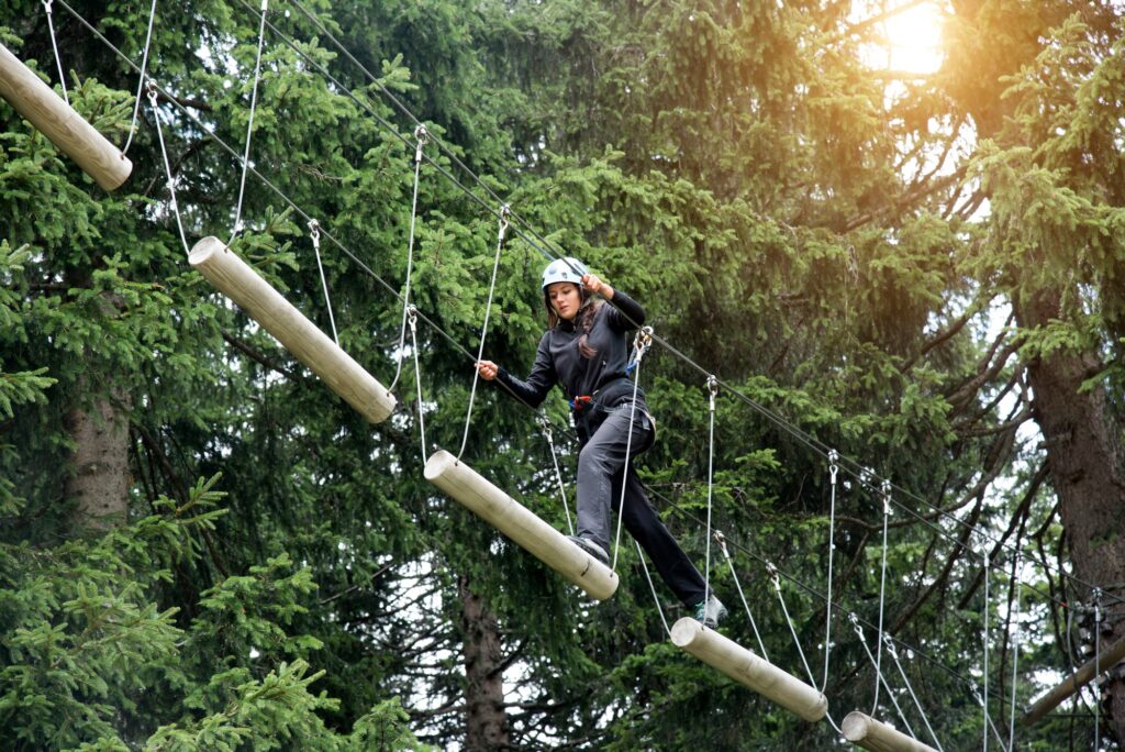 Teenage girl on high rope course